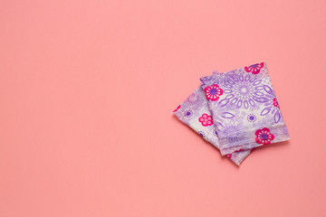 Menstruation sanitary soft pad for woman hygiene protection. Woman critical days, gynecological menstruation cycle. Pink background