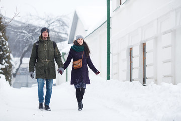 Happy Young Couple in Winter city having fun.