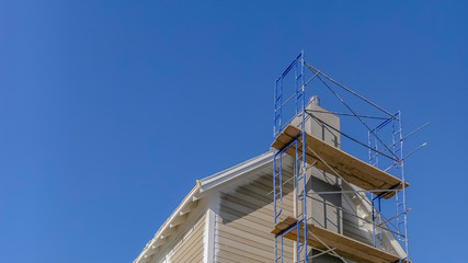 Scaffolding used in construction against blue sky