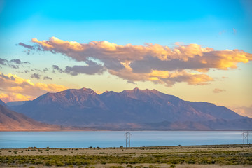 Utah Lake against rugged mountain and puffy clouds