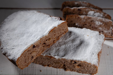Bakery products. Christmas stollen on a white background in cut form.