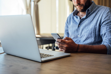 Young Businessman Working at Cafe
