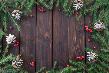 Fototapeta na wymiar Christmas fir tree with decoration on a wooden board. Copy space for text