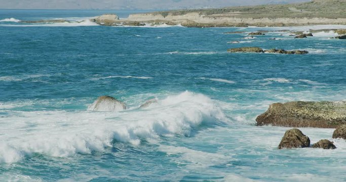 Slow motion of the rugged coastline from the bluffs at Montana de Oro State Park, California