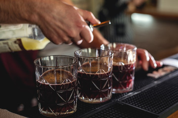 Fototapeta na wymiar Bartender hand with fashion cocktail bar