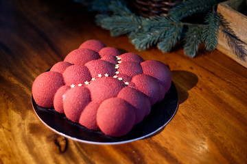 a cake in the shape of a Cloud with raspberry
