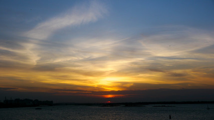 Fototapeta na wymiar Magnificent colored sunset on the blue Volga