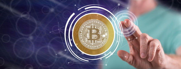 Man touching a bitcoin currency concept