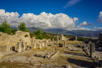 Fototapeta na wymiar Xanthos ancient city. The ruins of ancient city of Xanthos - Letoon (Xantos, Xhantos, Xanths) in Lycian way, Kas, Antalya/Turkey. Amazing dramatic cloudy sky background.