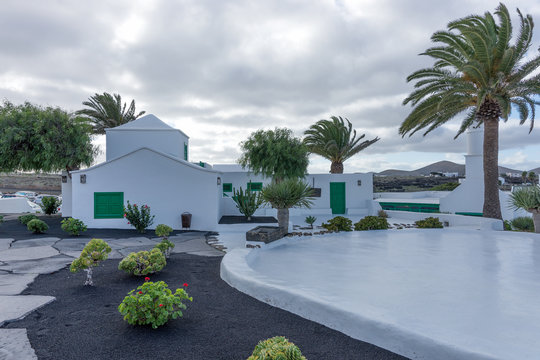 Street view of beautiful residential white and green house in Lanzarote, Canary Islands, Spain