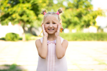 funny portrait of little girl. Emotions of cruel