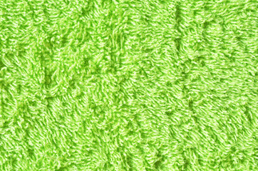 Soft green texture of towel. Green towel texture. Cotton towel background and texture