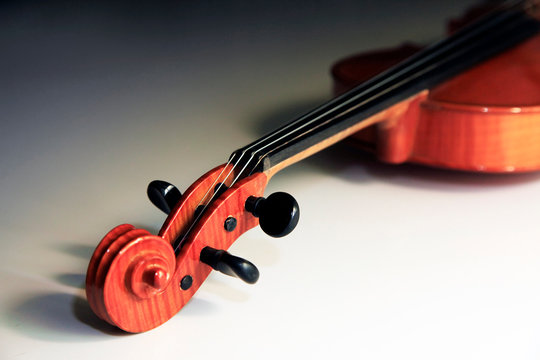 Old violin on the dim background