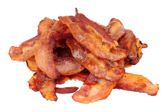 Fried smoked streaky bacon rashers isolated on a white background