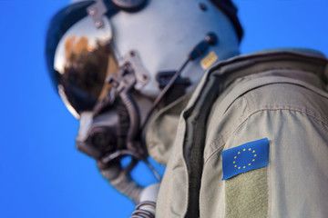 Jet aircraft pilot flight suit uniform with EU flag patch.