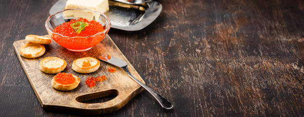 Canape with red salmon caviar