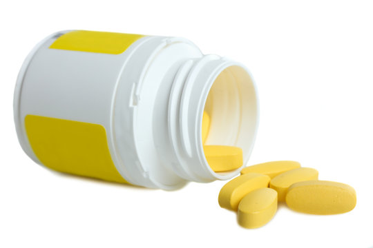 Yellow vitamins and bottle