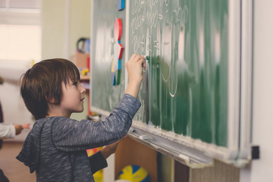 First Grade Child, Learning Math, Shapes And Colors At School