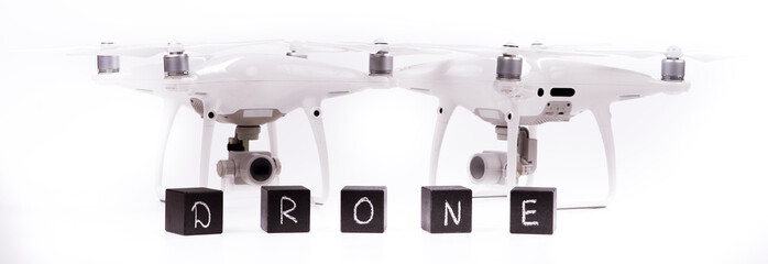 Flying drones on a white background with inscriptions "sale drone"