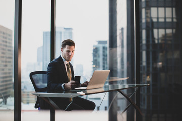 Businessman working in executive office in a skyscraper
