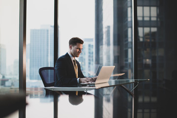 Businessman working in executive office in a skyscraper