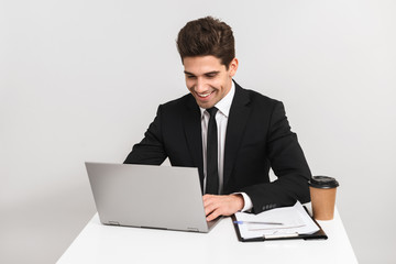 Smiling young business man wearing suit