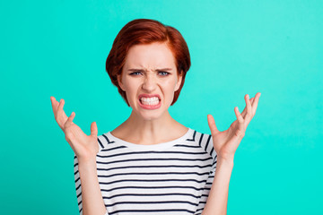 Portrait of nice charming attractive mad distracted red-haired lady in striped pullover showing rage gesture isolated over bright vivid shine green turquoise background