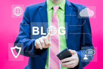 Businessman presses button blog icon on smartphone.