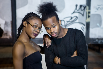 Contemporary ethnic couple looking at camera