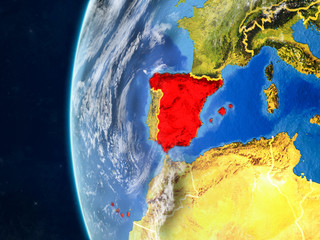Spain from space on model of planet Earth with country borders and very detailed planet surface and clouds.