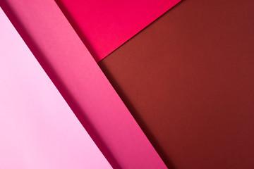 Background of shape and geometry. Colored background decorations with paper. Shades of pink.