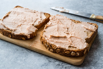 Fototapeta na wymiar Tuna Cream Paste with Toast Bread on Wooden Board / Creamed Fish Pate.