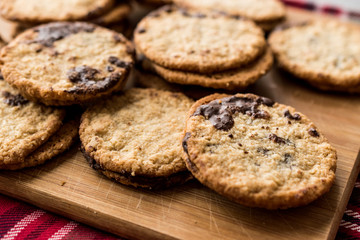 Classic Swedish Oatmeal Cookies with Chocolate on Wooden Board.