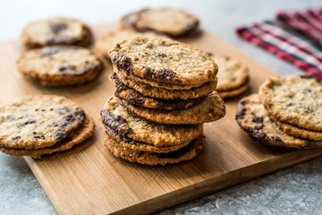 Classic Swedish Oatmeal Cookies with Chocolate on Wooden Board.