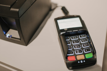 Payment terminal lying on shop counter