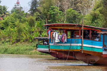 Fototapeta na wymiar Wooden boat used as a house Laos