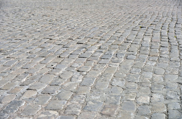 Fototapeta premium Old cobblestone pavement close-up.