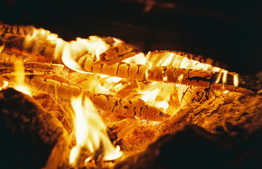 Coals smoldering in the fire