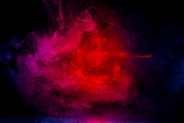 Obraz premium red and blue smoke patterns at dark background