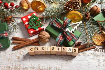 christmas  background on white wooden board with blocks forming the inscription 