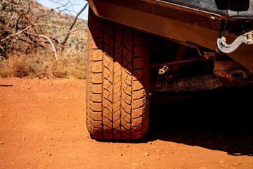 The detail of an off-road tyre on a Japanese 4x4 car © mino21