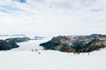 Snow slope over cloud and Mountain valley of mount Titlis, Engelberg