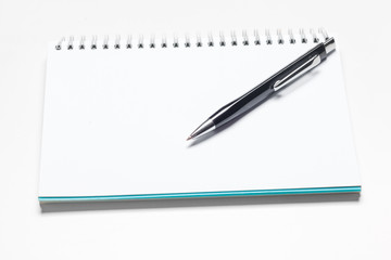 notepad notebook and ball pont pen isolated on white background
