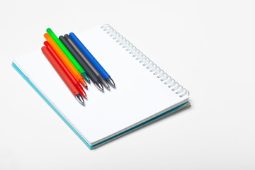 notepad notebook and ball pont pen isolated on white background