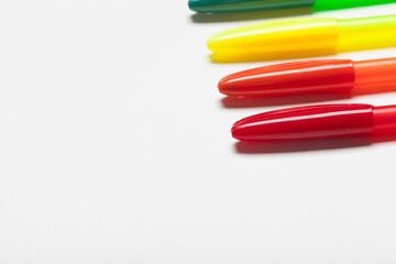 different colors pens isolated on the white background