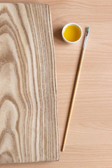 treatment of wood with impregnation for protection. linseed oil on the board with a brush. wooden...