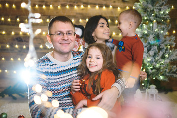 happy family at christmas tree