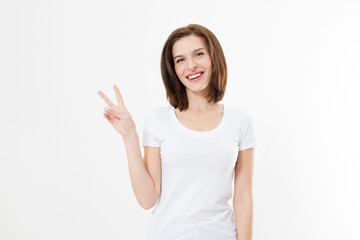 Happy young caucasian girl showing victory sign isolated on white background. Copy space. Template and blank summer t shirt.