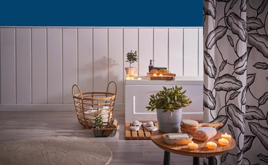 Decorative bath room, bath and tub, white and blue wall background, curtain style.