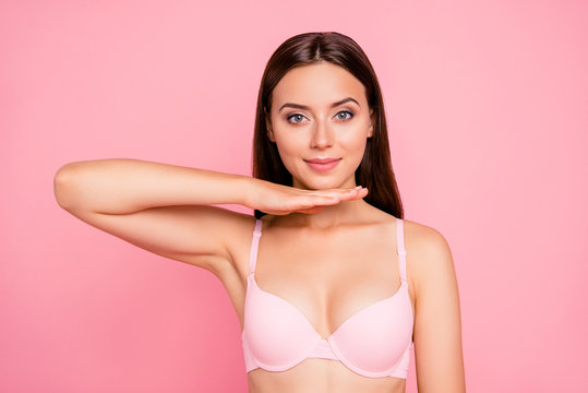 Close up portrait of attractive gorgeous gentle tender hand up touching chin showing correction influence her she woman wearing pale pink bra isolated on rose background